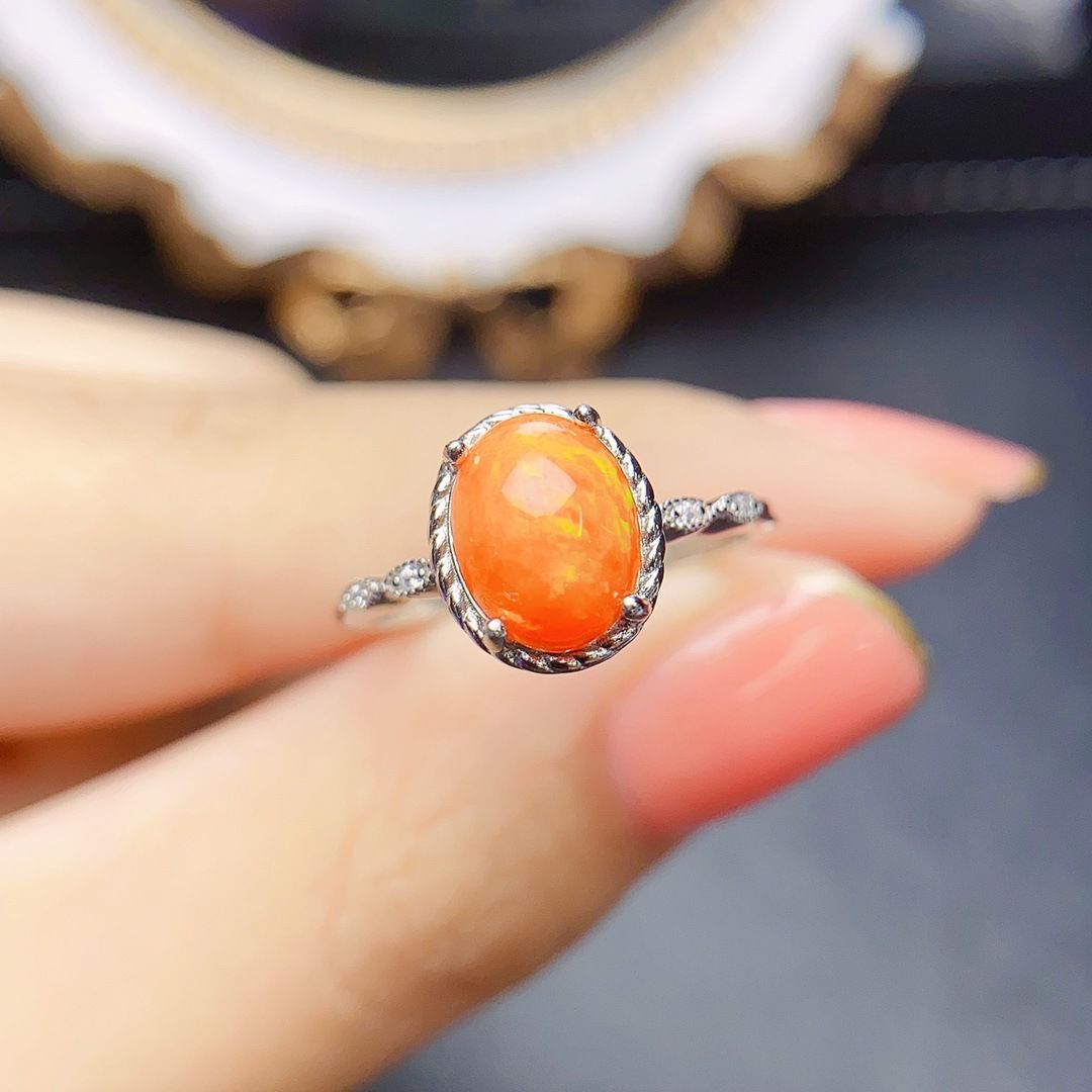 Factory wholesale explosions natural fire opal ring S925 silver inlaid main stone 7*9 hot Europe and the United States a generation of hair