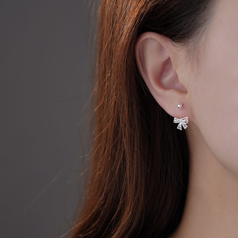 Po S999 Foot Silver Hollow Bowknot Screw Earrings Fresh and Sweet Artistic Gentle Wind Anti-dropping Earrings