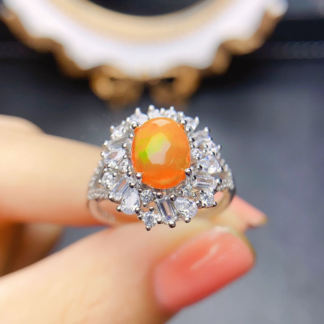 Factory wholesale explosions natural fire opal ring S925 silver inlaid main stone 7*9 hot Europe and the United States a generation of hair