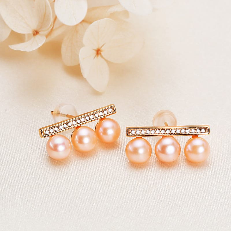 Balance beam pink pearl stud earrings