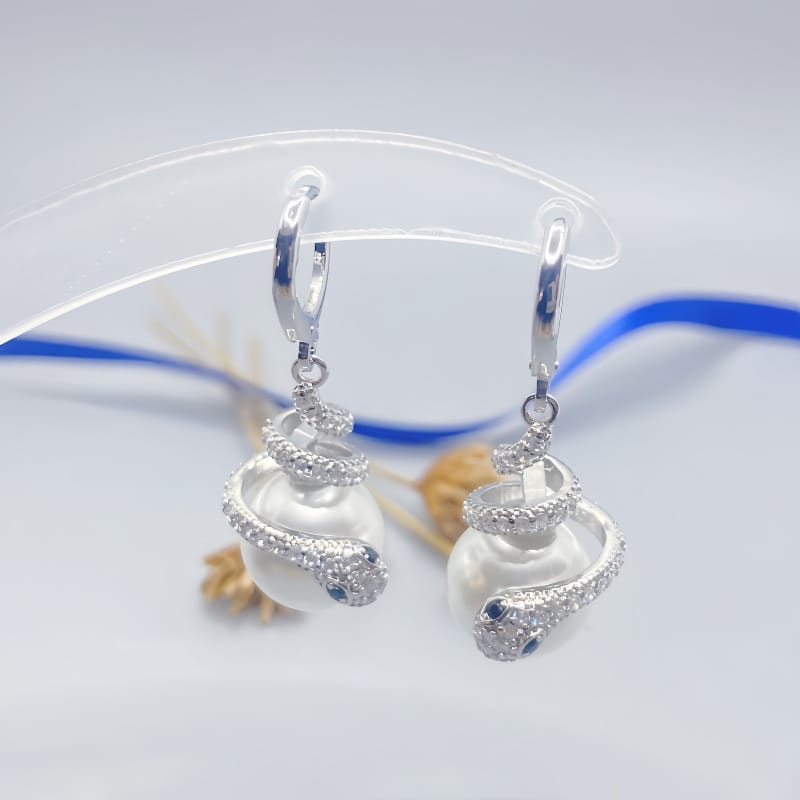 Coiled snake pearl silver earrings