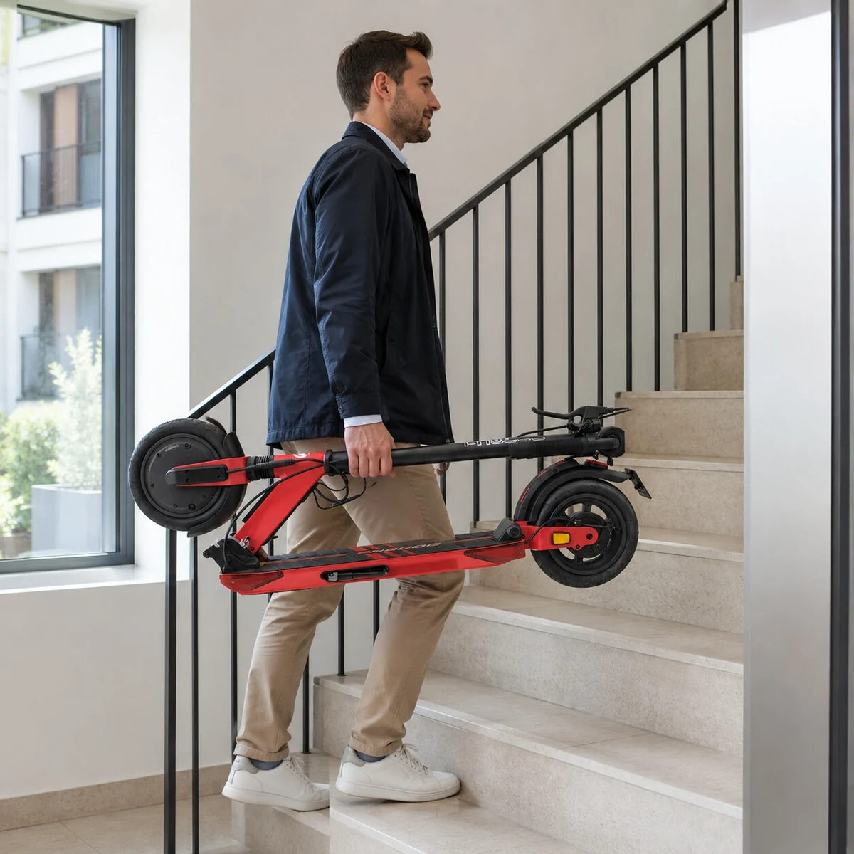 Rider carrying a folded Butterfly Ultra upstairs