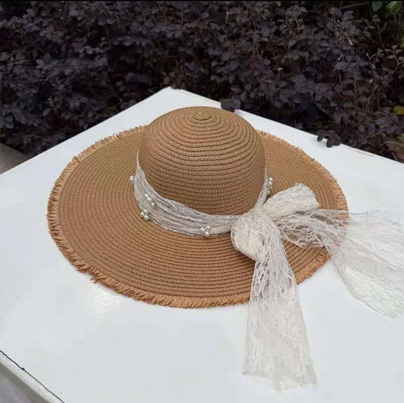 Bohemian camel straw sun hat with frayed edge, white lace ribbon and pearl decoration for summer trips