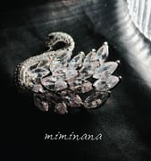 Sparkling marquise cut crystal swan pin black fabric backdrop
