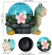 Solar turtle night light with crackle glass shell and pink flower accent, waterproof resin figurine for patio.