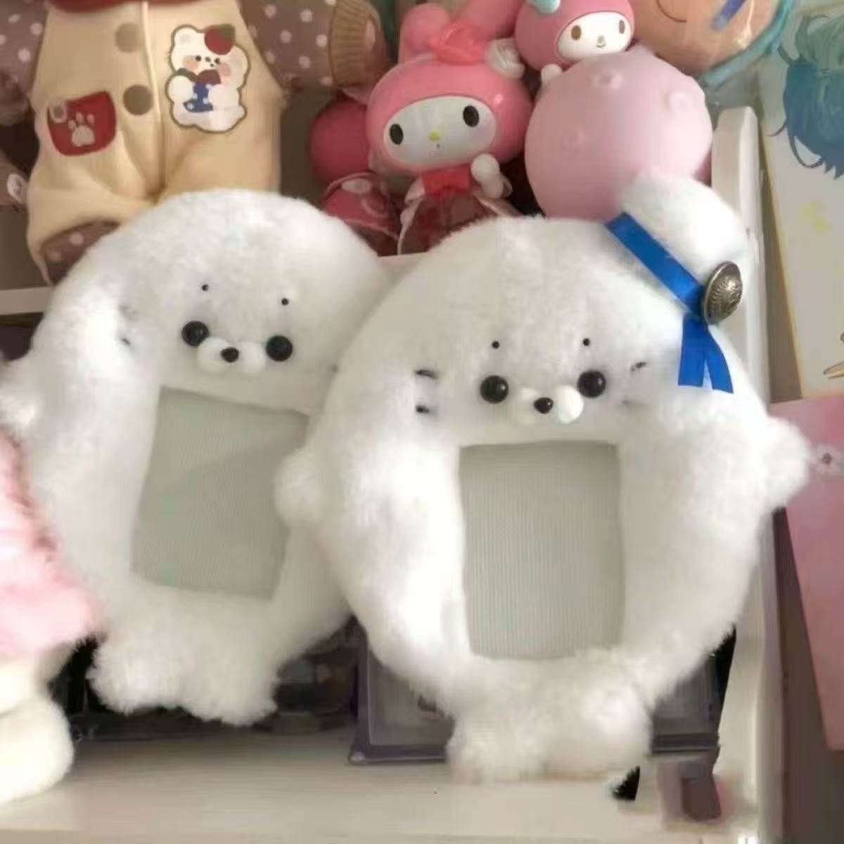 Fluffy white seal plush card protector with a blue bow, pure cotton kawaii accessory.