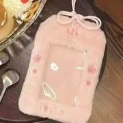 Pastel pink plush card holder with rose embroidery and a bow design for a soft aesthetic.