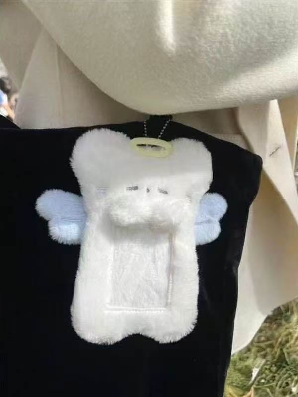 Soft white angel bear plush photo sleeve for your favorite cards, featuring blue wings.