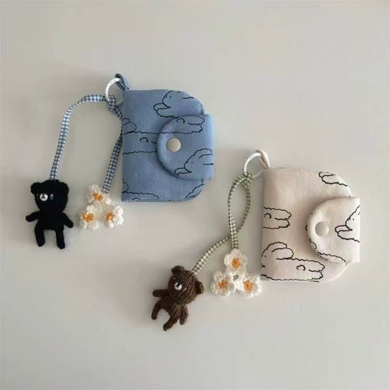 Floral patterned canvas mini pouch with pink fluffy keychain, perfect as a cute Y2K bag charm or small accessory organizer.
