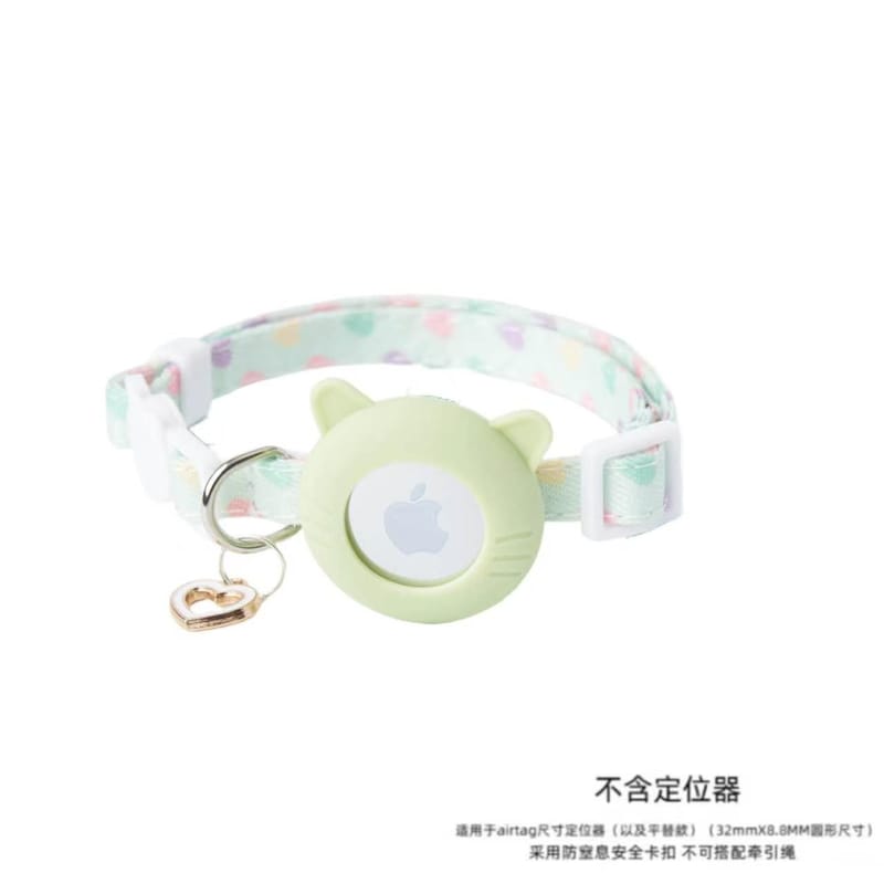 Mint green safety cat collar with silicone AirTag holder and metal heart pendant.