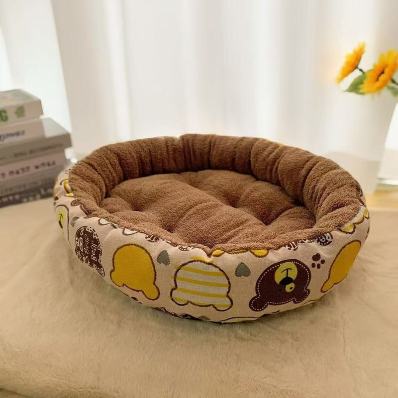 Round PP cotton pet bed with yellow bear pattern, brown plush interior, warm donut cat dog bed.