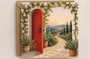 Tuscan red door with white flowers opening to Italian countryside - floral birthday card. See What Opens 300gsm coated paper.