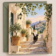 Friendship greeting card featuring a Mediterranean hillside village and black cat