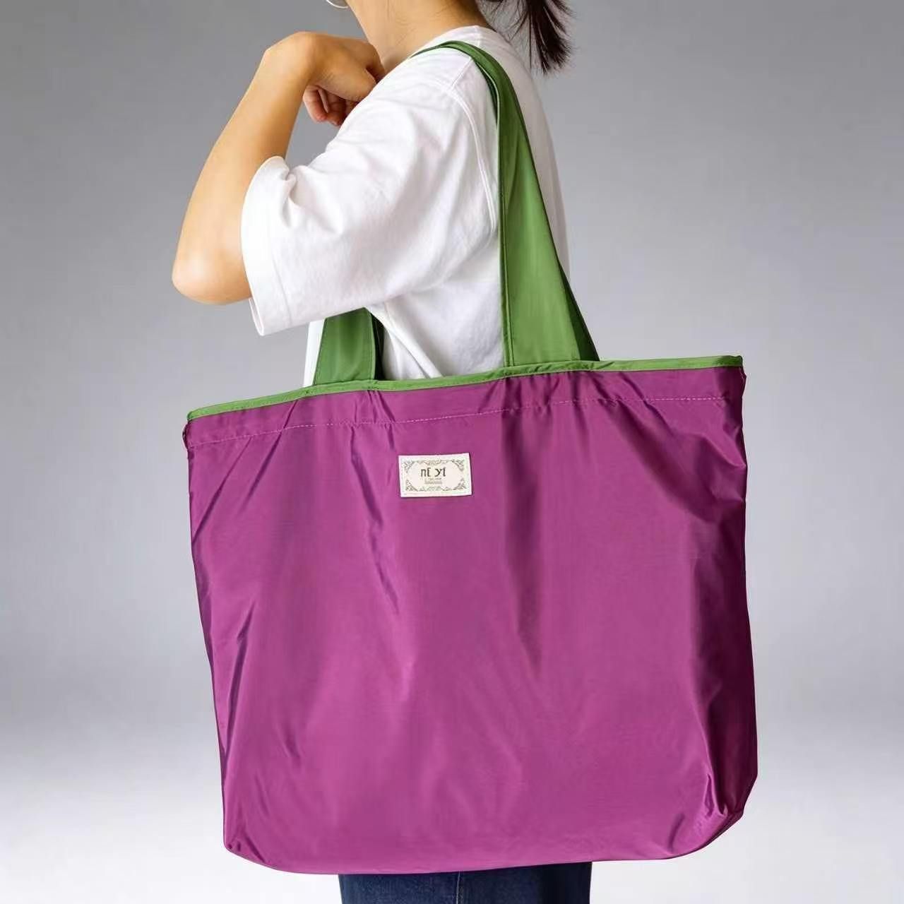 Green shoulder strap, purple shopping bag with inner pocket design