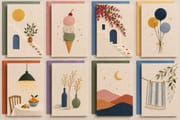 DIY embroidery-style greeting cards with flowers, a potted plant, colorful balloons, a pendant lamp, decorative vases, moonlit hills, and hanging textiles.