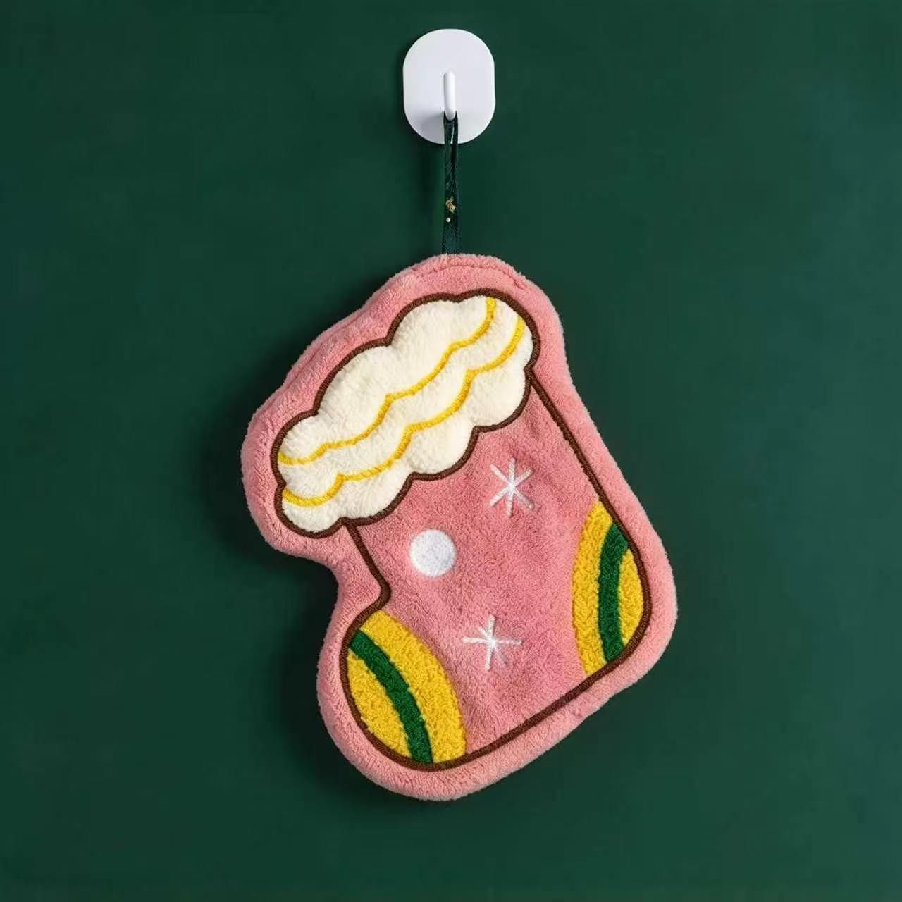 Pink Christmas stocking shaped hanging towel with yellow and green details