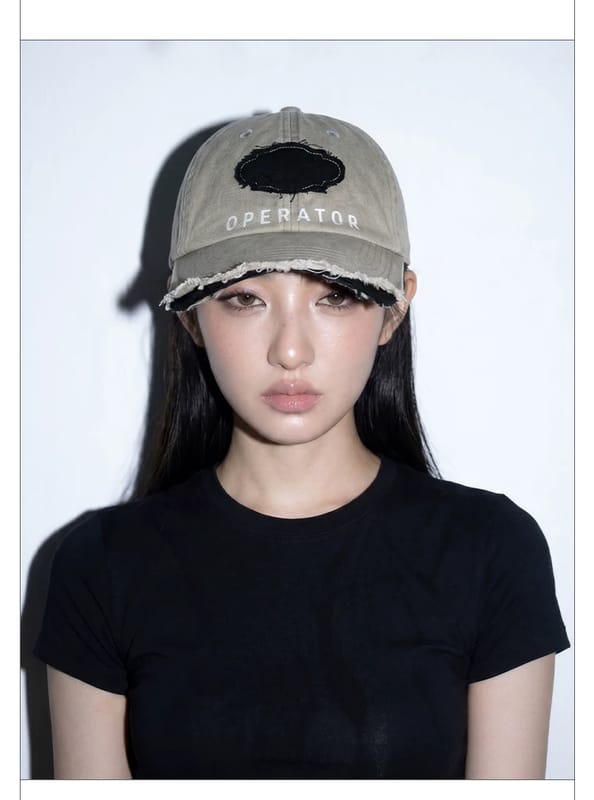 Worn brim badge baseball cap with washed distressed design, street style