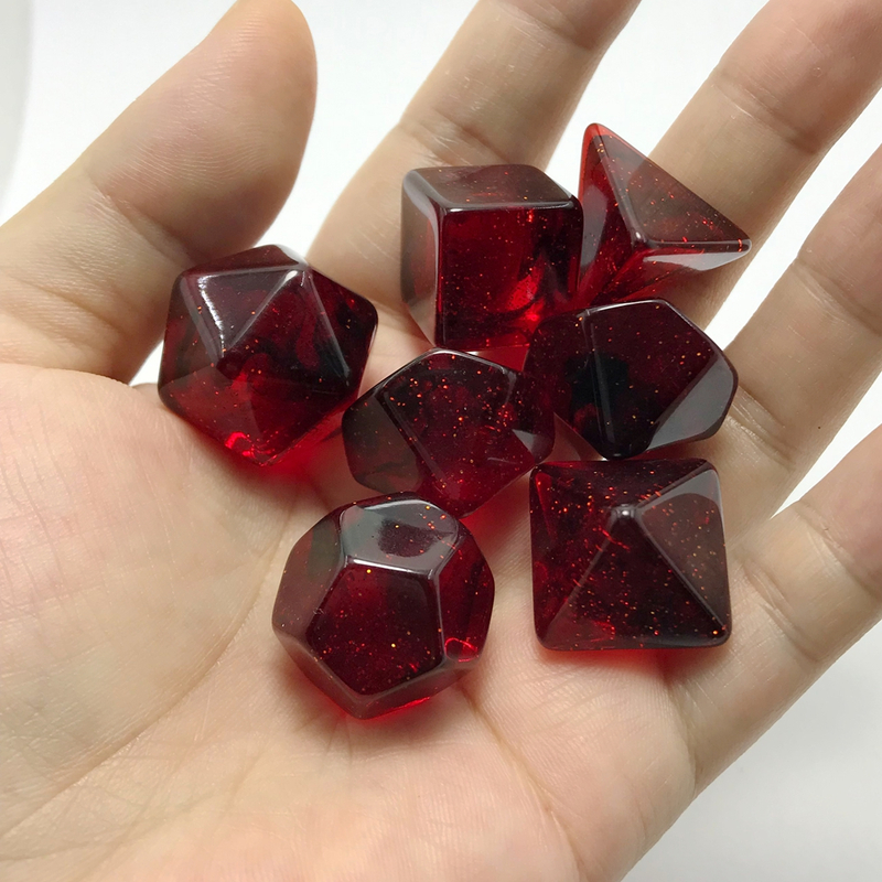 Transparent red with gold glitter flakes and black glitter strands